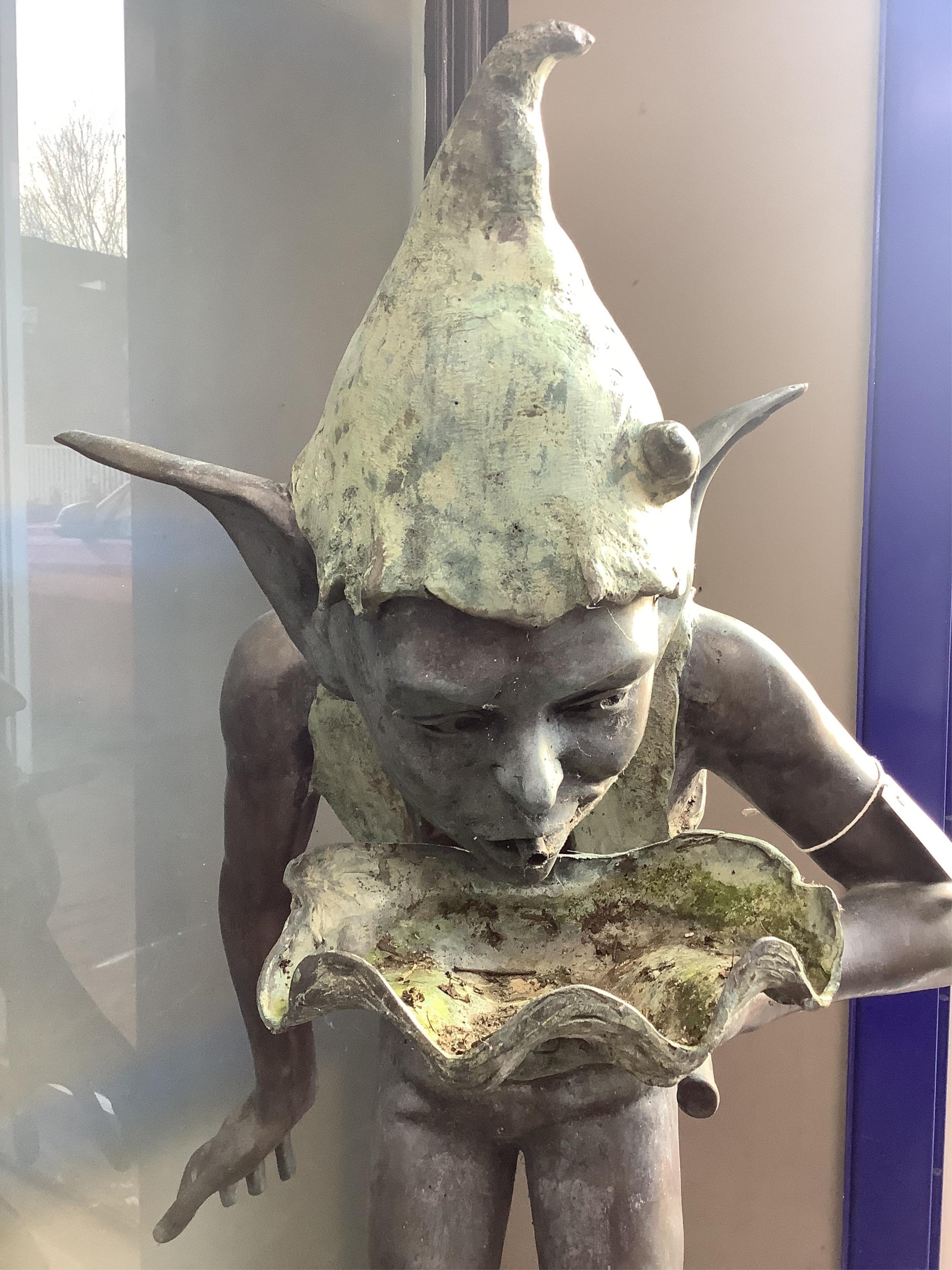 In the Manner of David Goode, a bronze garden sprite fountain, height 116cm. Condition - fair